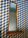 Wall mirror with shelf