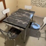 Table and 4 chairs in Formica.