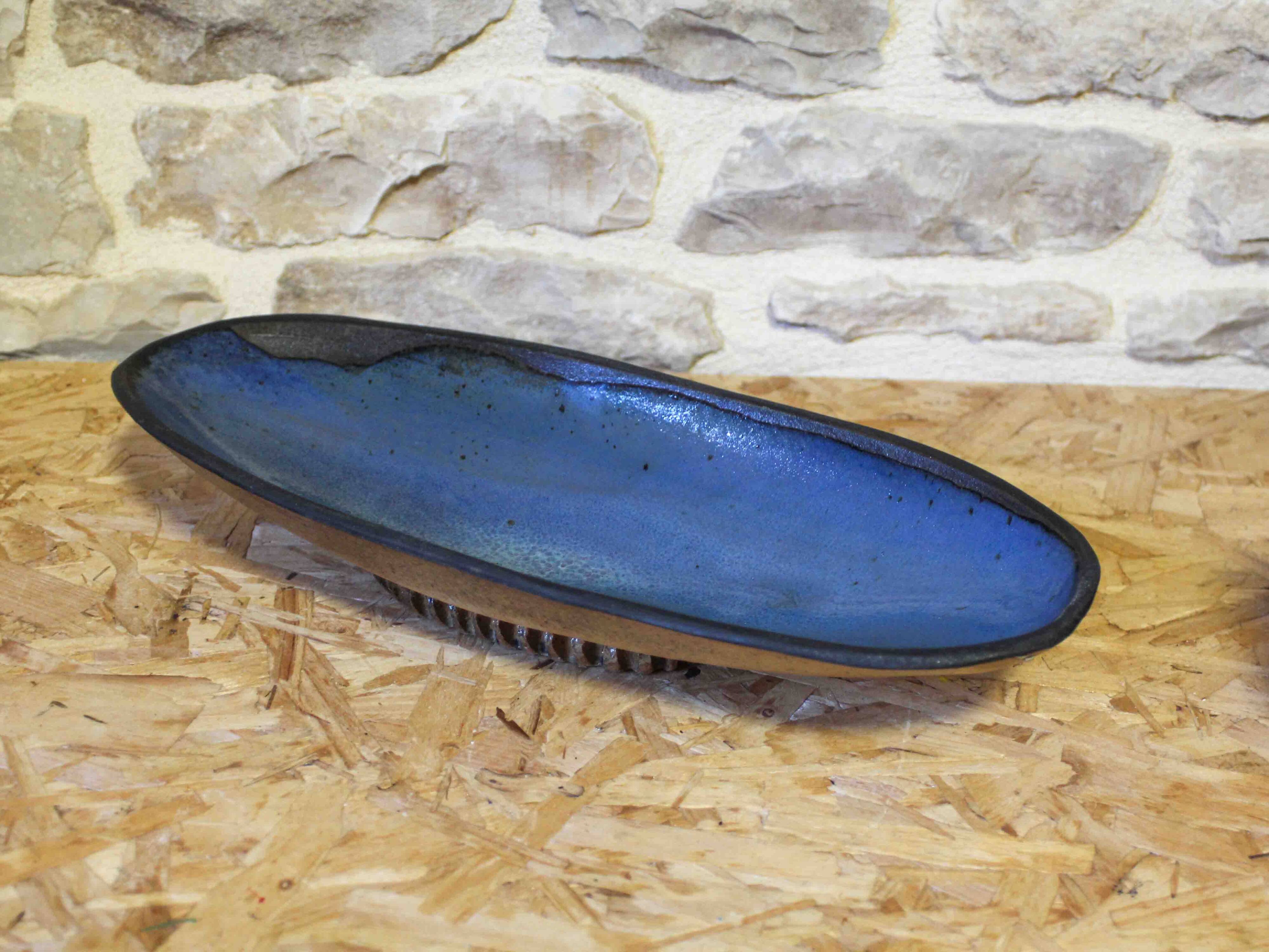 Blue glazed ceramic cup