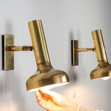 Set of three brass adjustable wall lamps