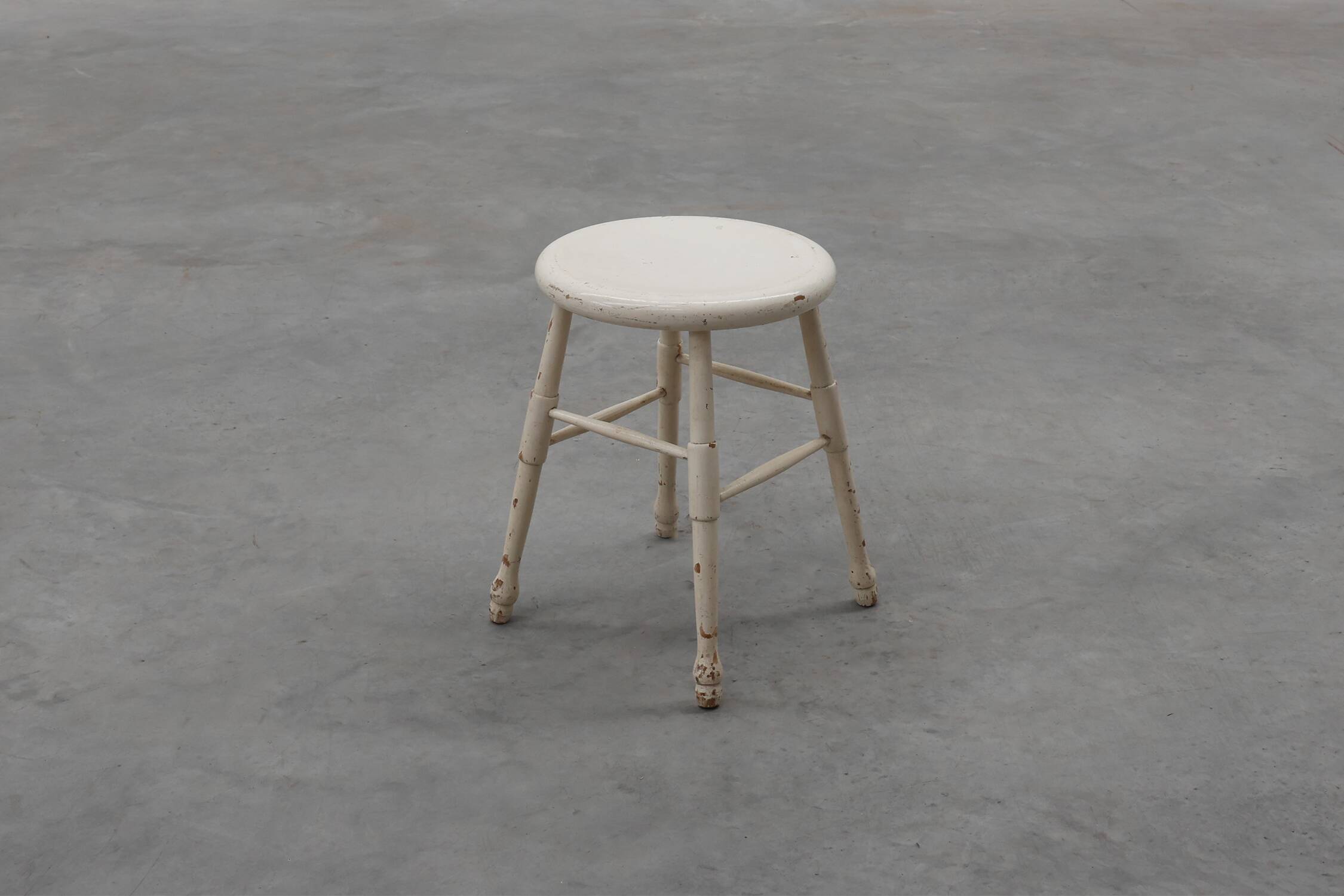 Rustic white wooden low farm stool, France ca. 1920