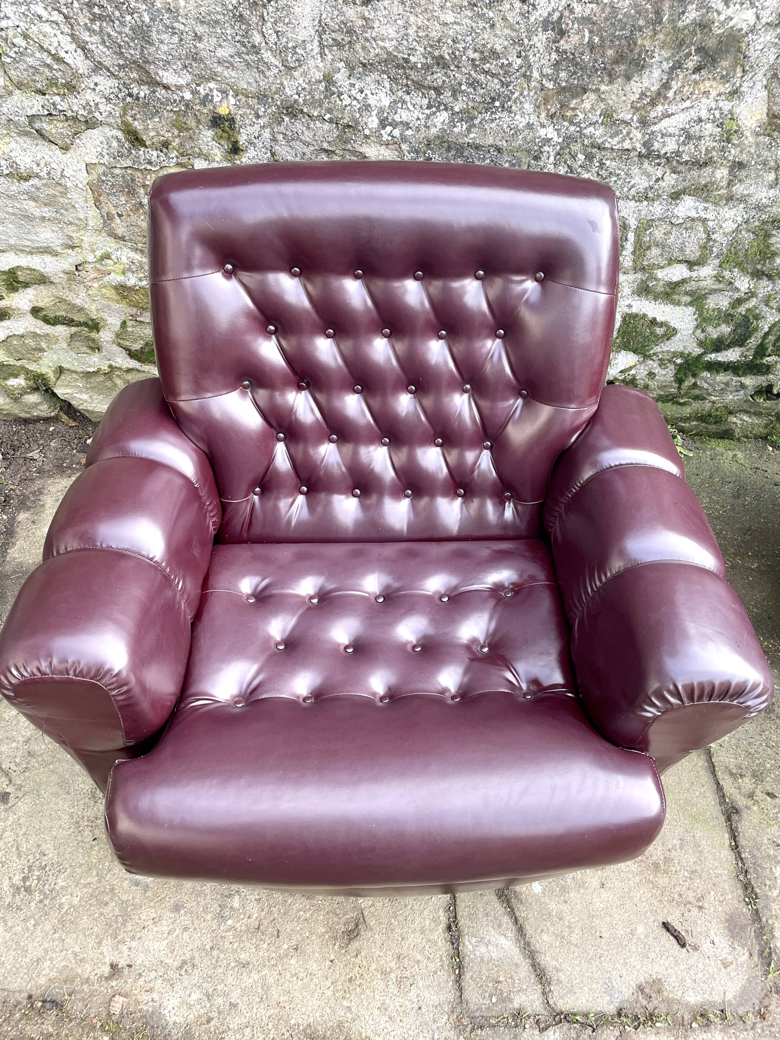 Pair of upholstered armchairs in aubergine imitation leather