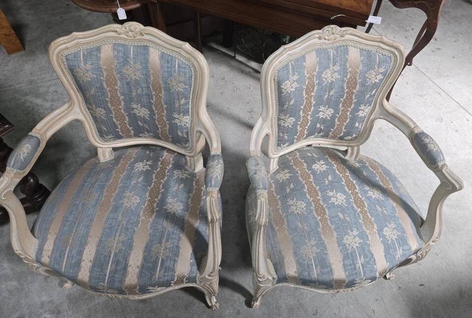 Pair of Louis XV style armchairs, in moulded and patinated wood.