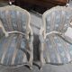 Pair of Louis XV style armchairs, in moulded and patinated wood.