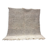 Large square rug made of 100% virgin wool with a graphic design in cream and black stripes.