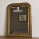 Miroir Louis Philippe fin 19ème. Doré. 75x56.