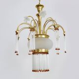 Art Nouveau style chandelier in brass with pendants and glass globe with 3 lights. Italy 70s 80s