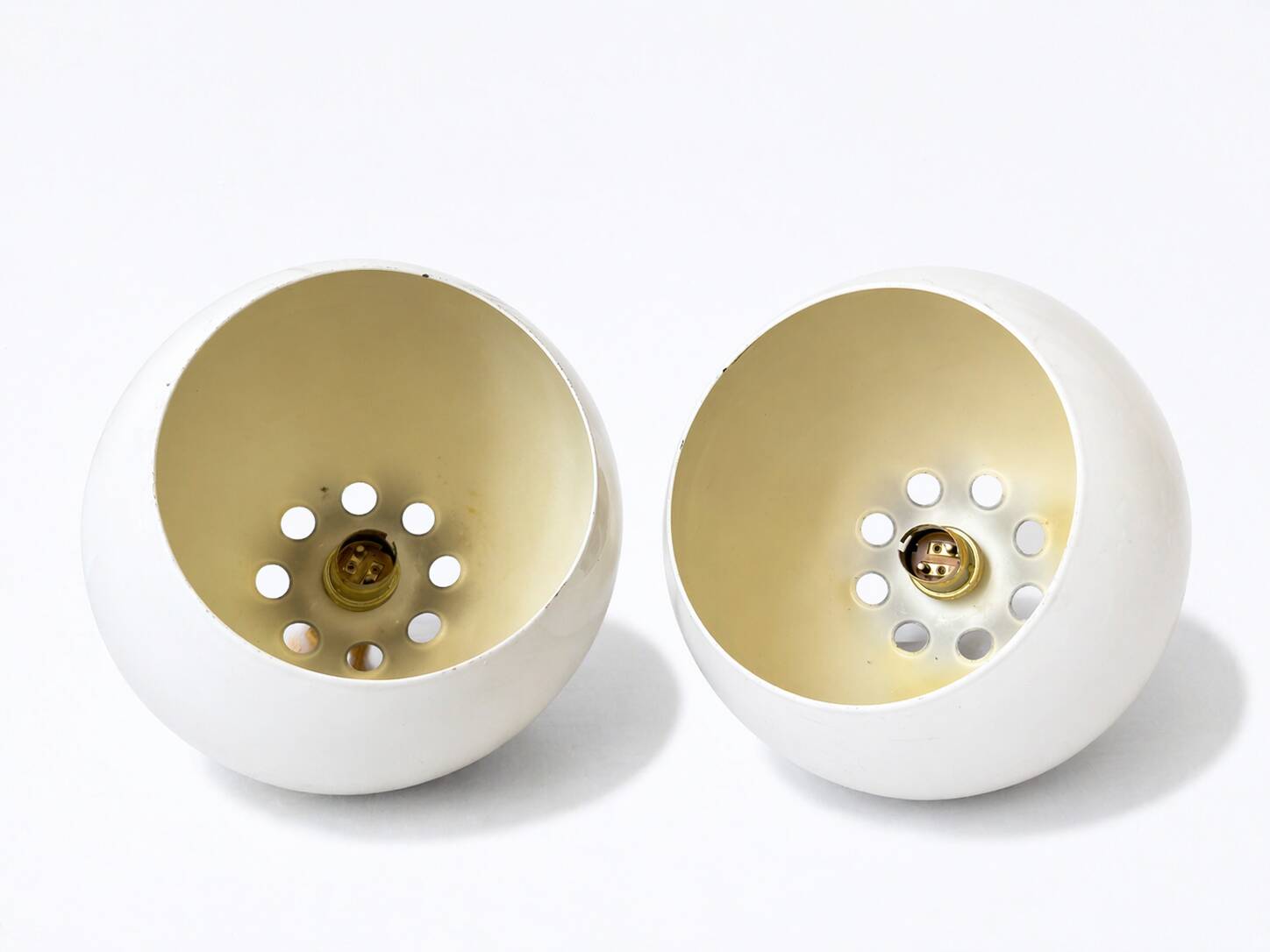 Two white metal globe pendant lights, 1970s.