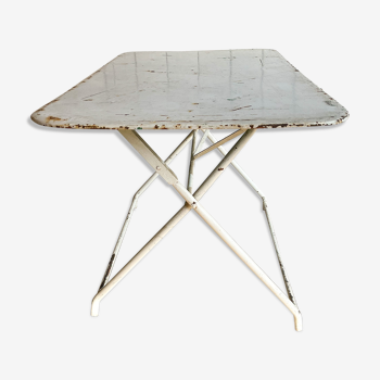 White folding metal bistro table