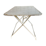 White folding metal bistro table