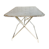 White folding metal bistro table