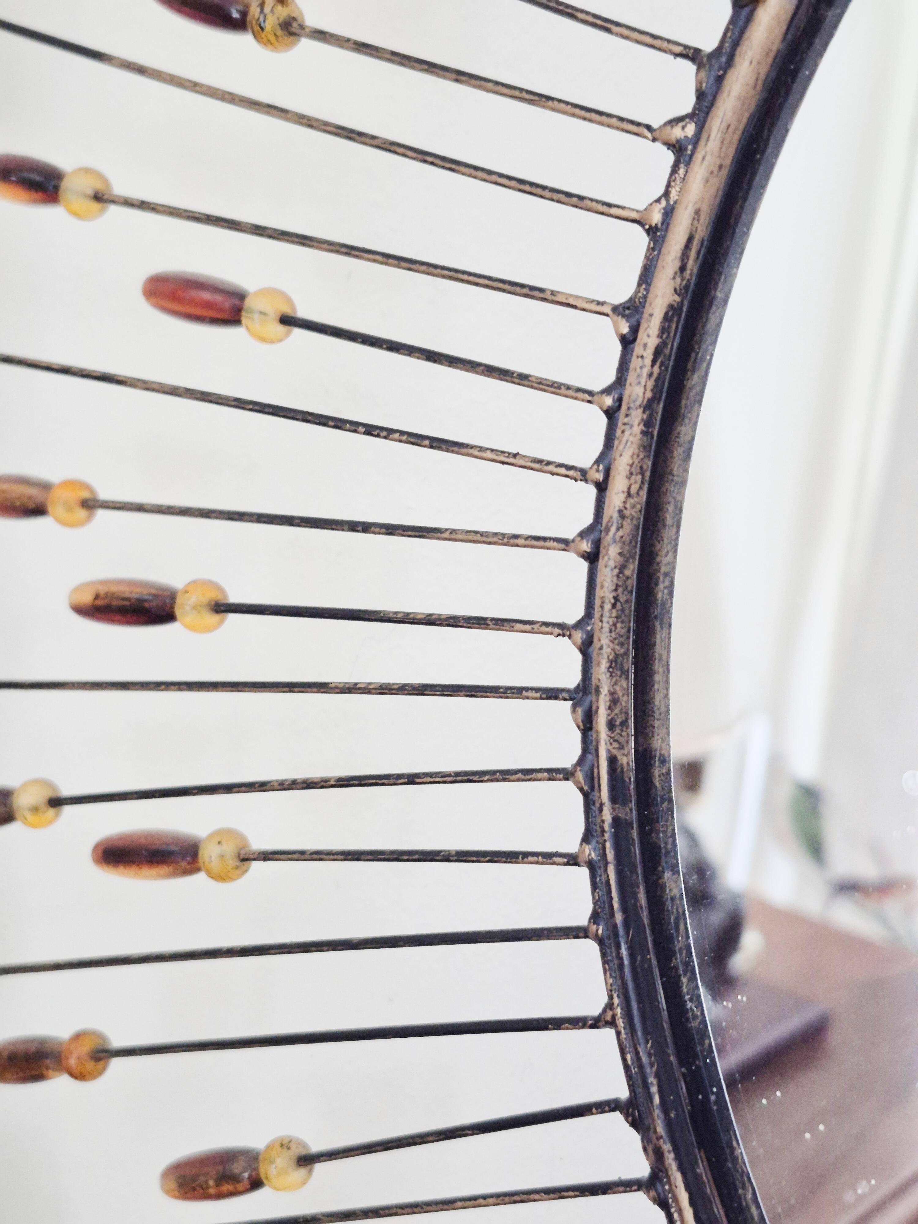 Vintage metal sun mirror in the style of Line Vautrin