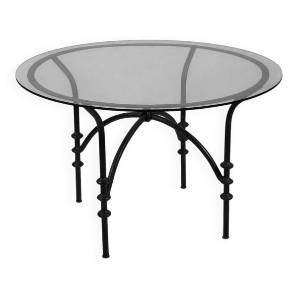 Table à manger vintage avec une base tubulaire et un plateau en verre avec un nœud.
