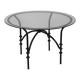 Table à manger vintage avec base tubulaire et plateau en verre avec un nœud.