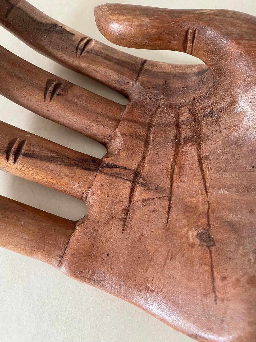 Wooden hand-held pocket emptier