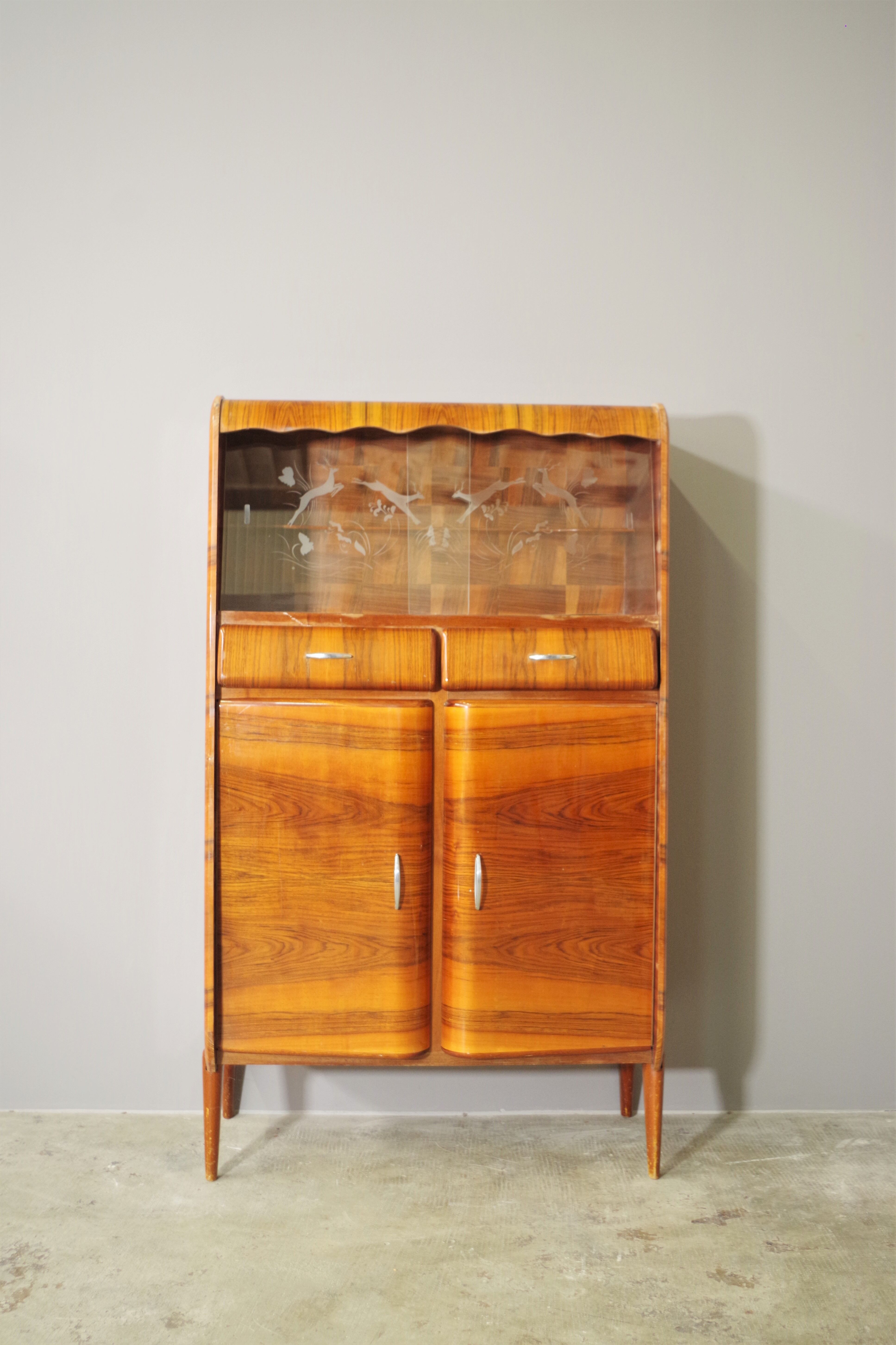 Rounded furniture from the 1950s in cherry veneer