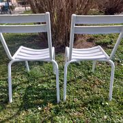 pair of white metal chairs, Tolix style