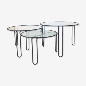 Set of three coffee tables black glass in the middle of the century with legs and metal hairpin