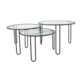 Set of three coffee tables black glass in the middle of the century with legs and metal hairpin