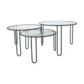 Set of three coffee tables black glass in the middle of the century with legs and metal hairpin