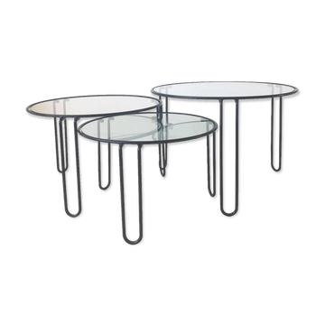 Set of three coffee tables black glass in the middle of the century with legs and metal hairpin