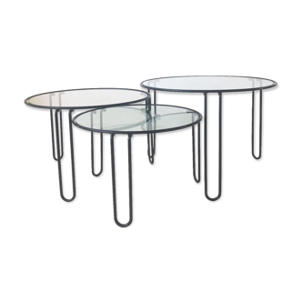 Set of three coffee tables black glass in the middle of the century with legs and metal hairpin