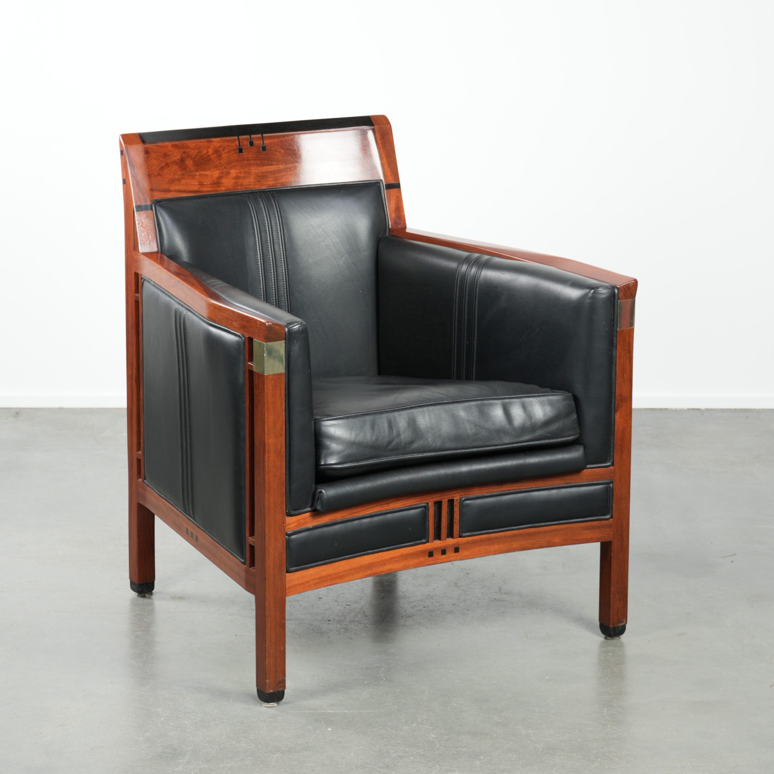 Black leather and wooden Art Deco design armchair