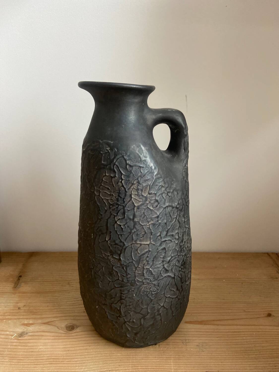 Black ceramic pitcher from the 50s