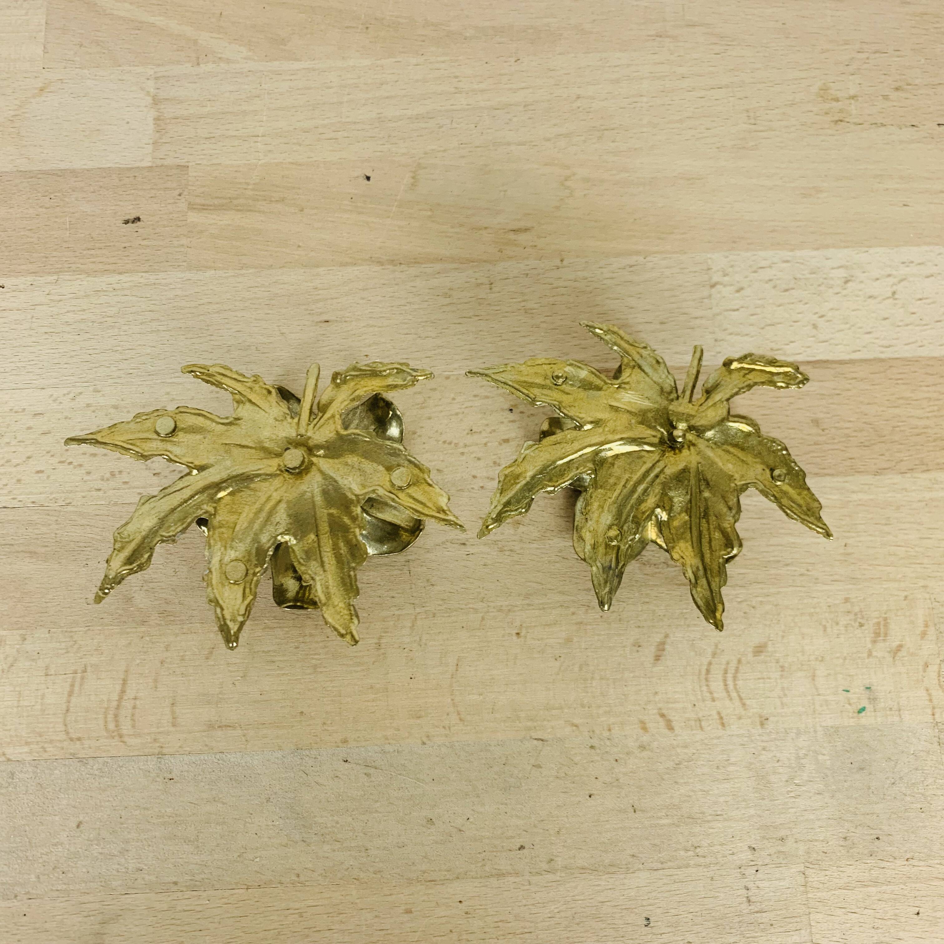Pair of gilded brass flower candlesticks
