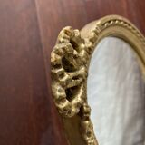 Oval wall mirror in baroque gilded plaster frame 29x20cm