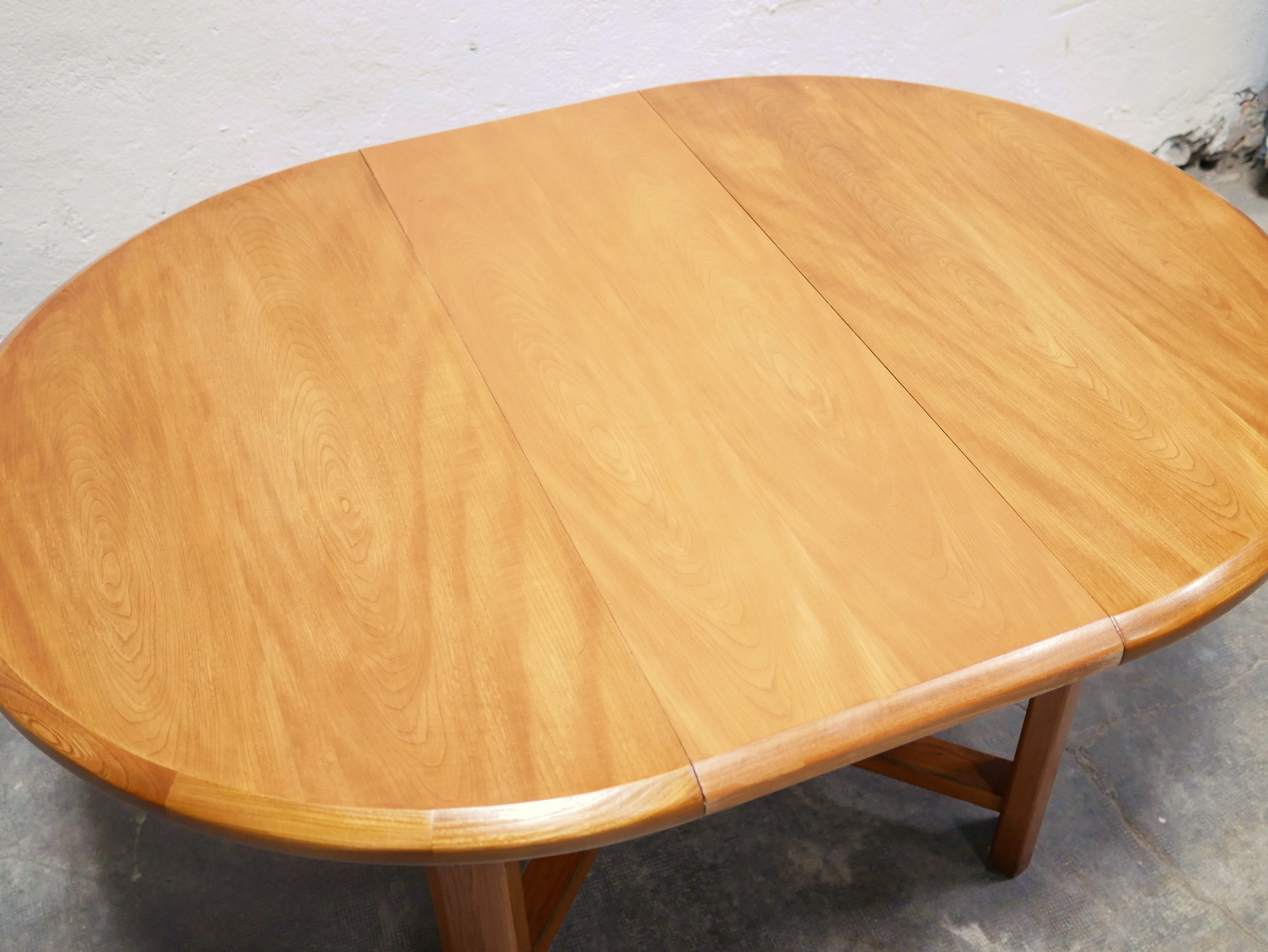 Vintage extendable round wooden dining table