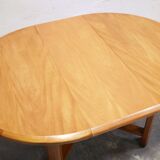 Vintage extendable round wooden dining table