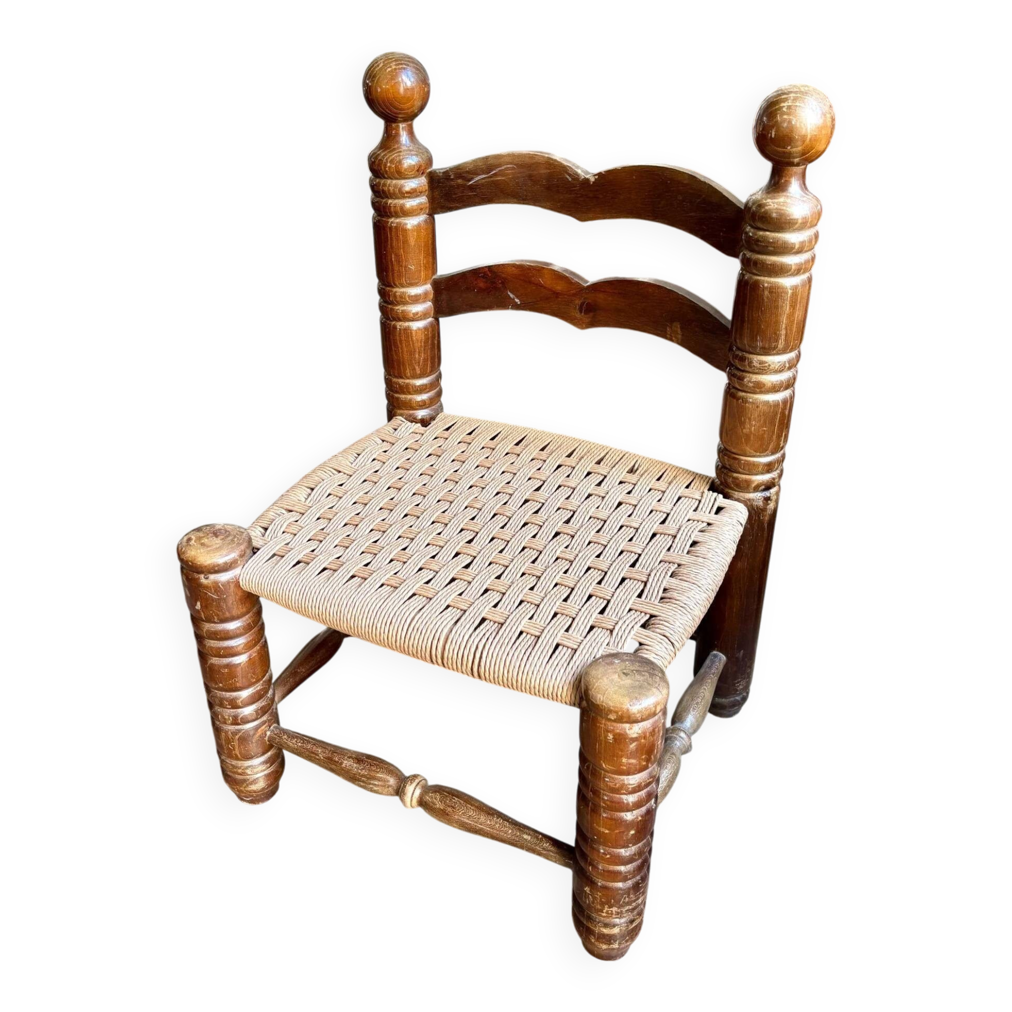 Low chair in dark wood and woven Danish cord attributed to Charles Dudouyt.
