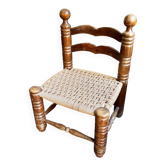 Low chair in dark wood and woven Danish cord attributed to Charles Dudouyt.