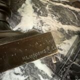 Patinated bronze vase with handles topped by bicéphalic busts, 19th century.