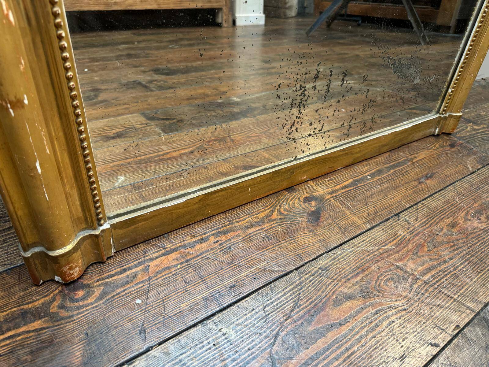 Antique gilded fireplace mirror