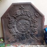 Old cast iron fireplace plate with lily flowers