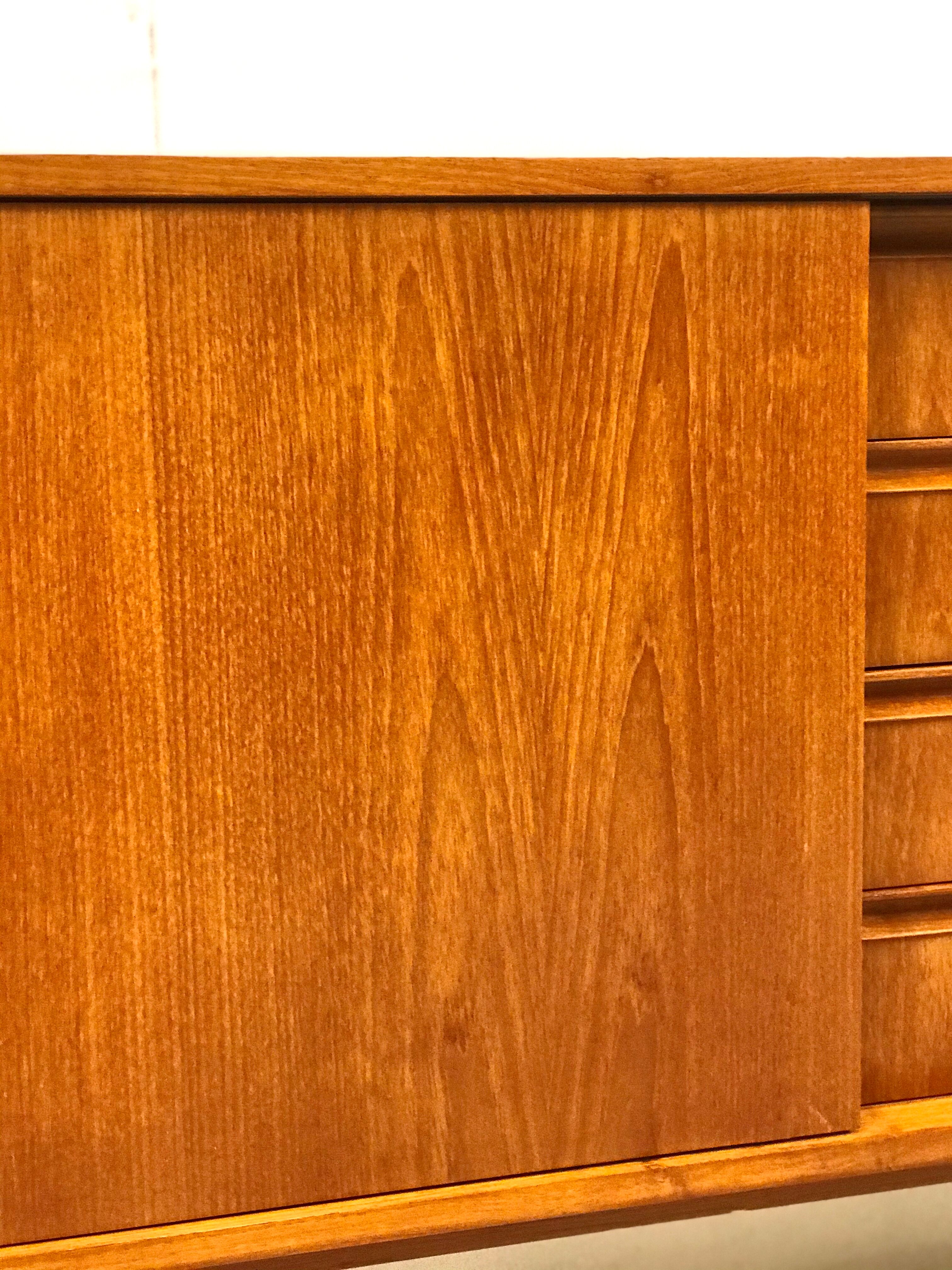 Danish teak sideboard with two sliding doors and 4 central drawers