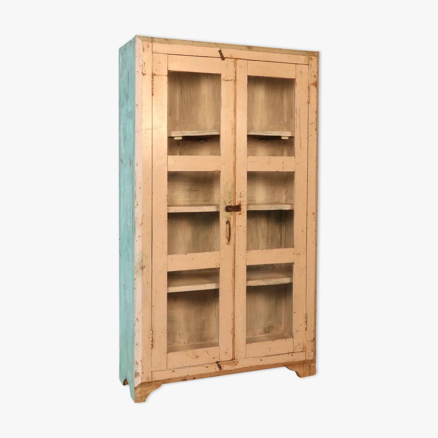 Teak display cabinet with a white-green patina.
