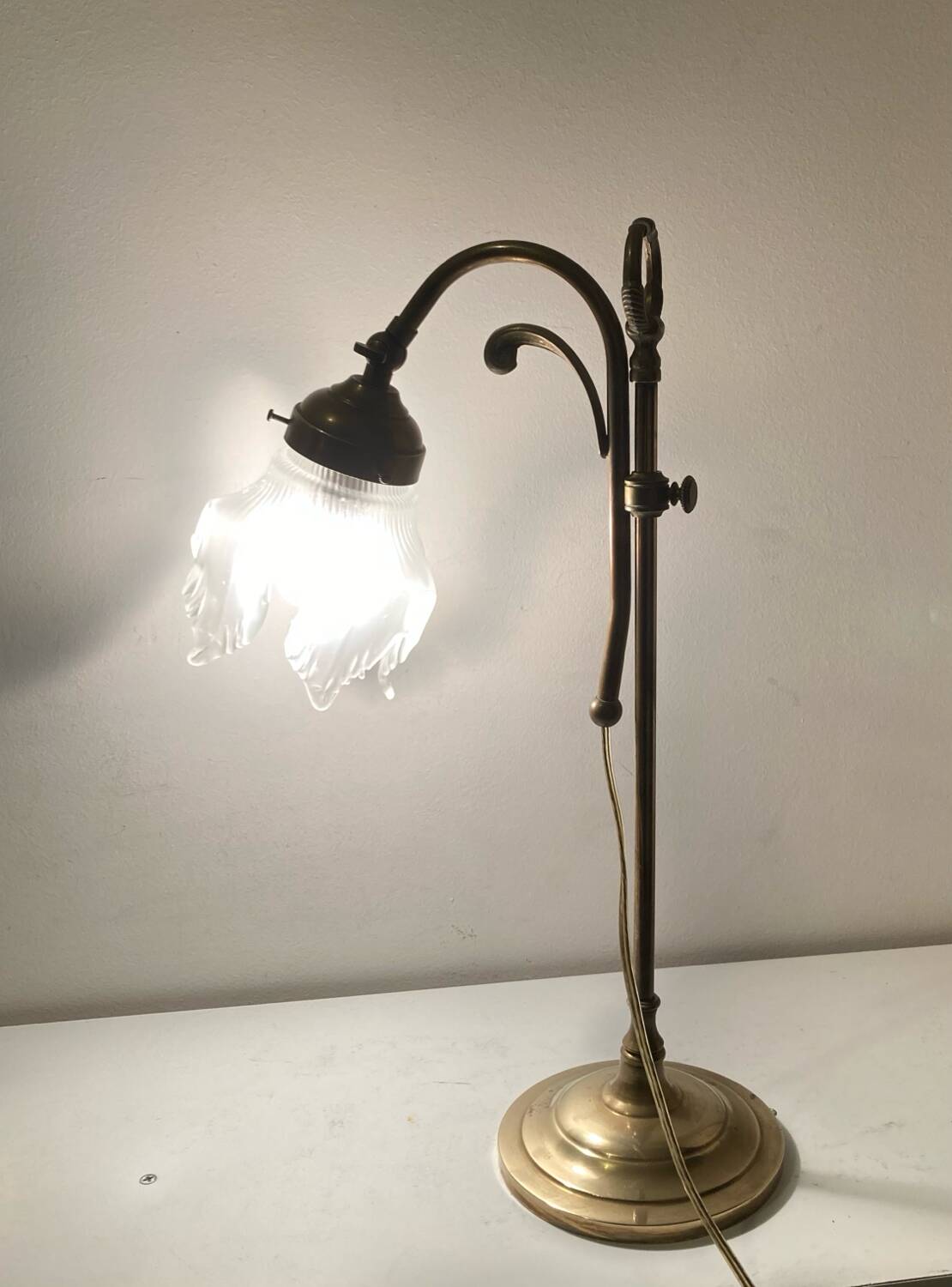 Brass table lamp with a glass shade