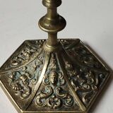 Baroque/Antique style torch candleholder, nineteenth, gilded bronze. Head motifs, volute arabesques