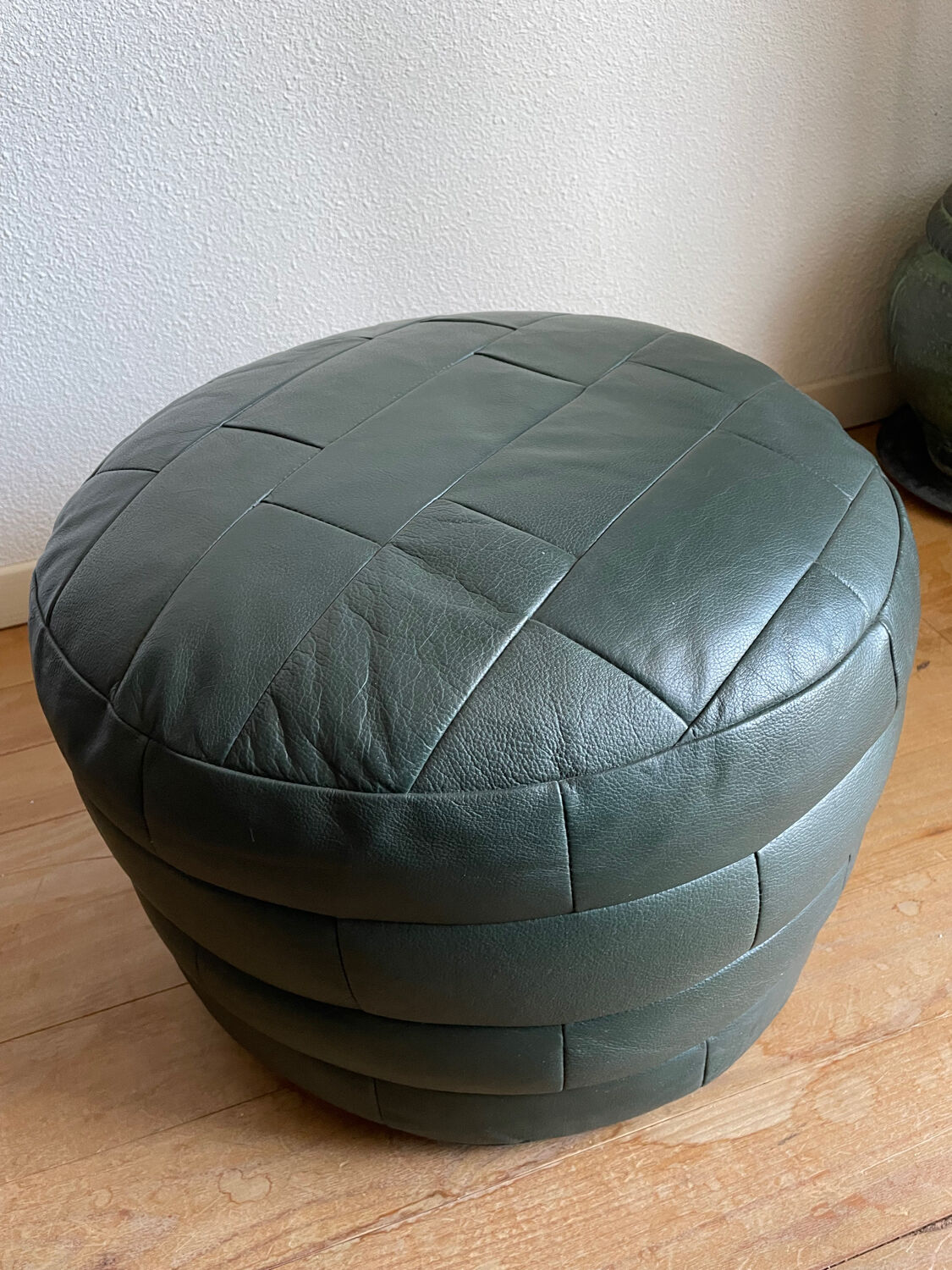 Green patchwork leather pouf from Sède