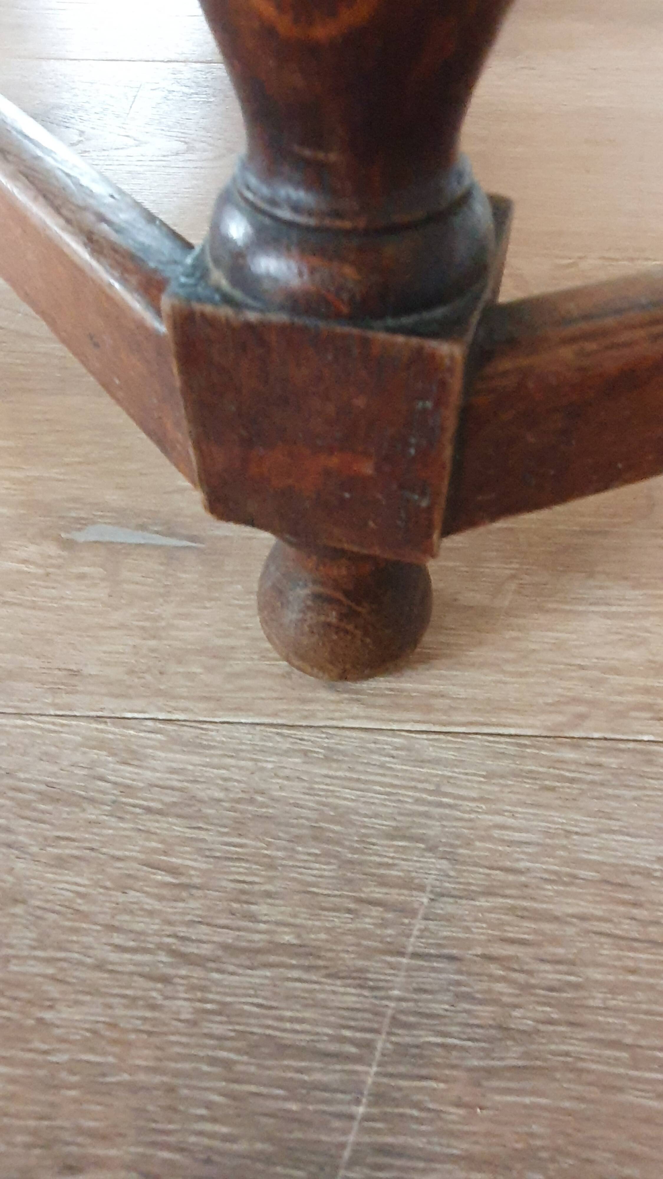 Round wooden table with beaded legs