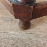 Round wooden table with beaded legs