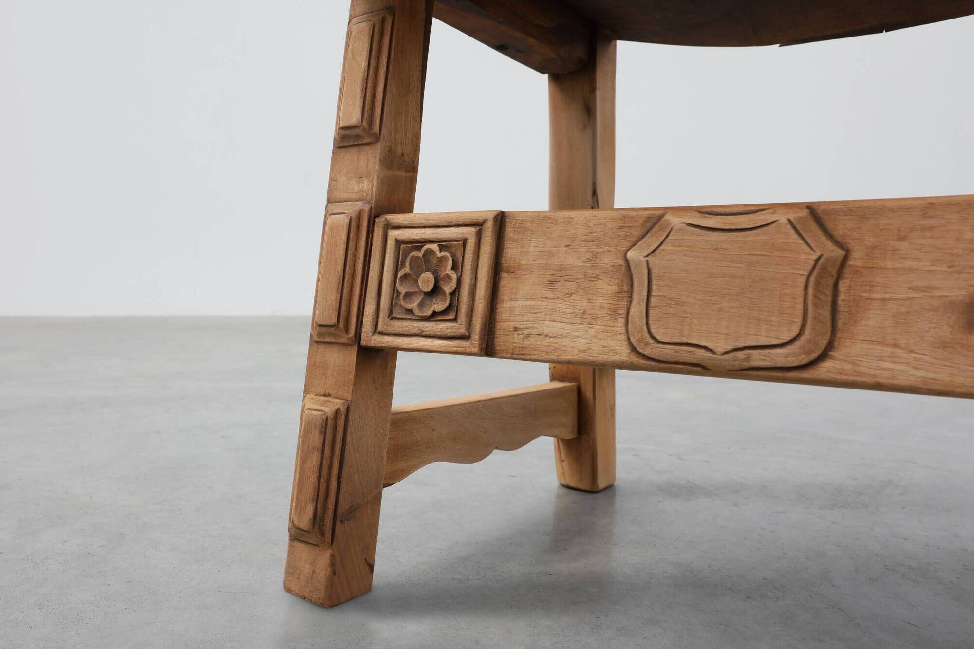 Brutalist armchair with carved rosettes and nailed wooden seat, Spain