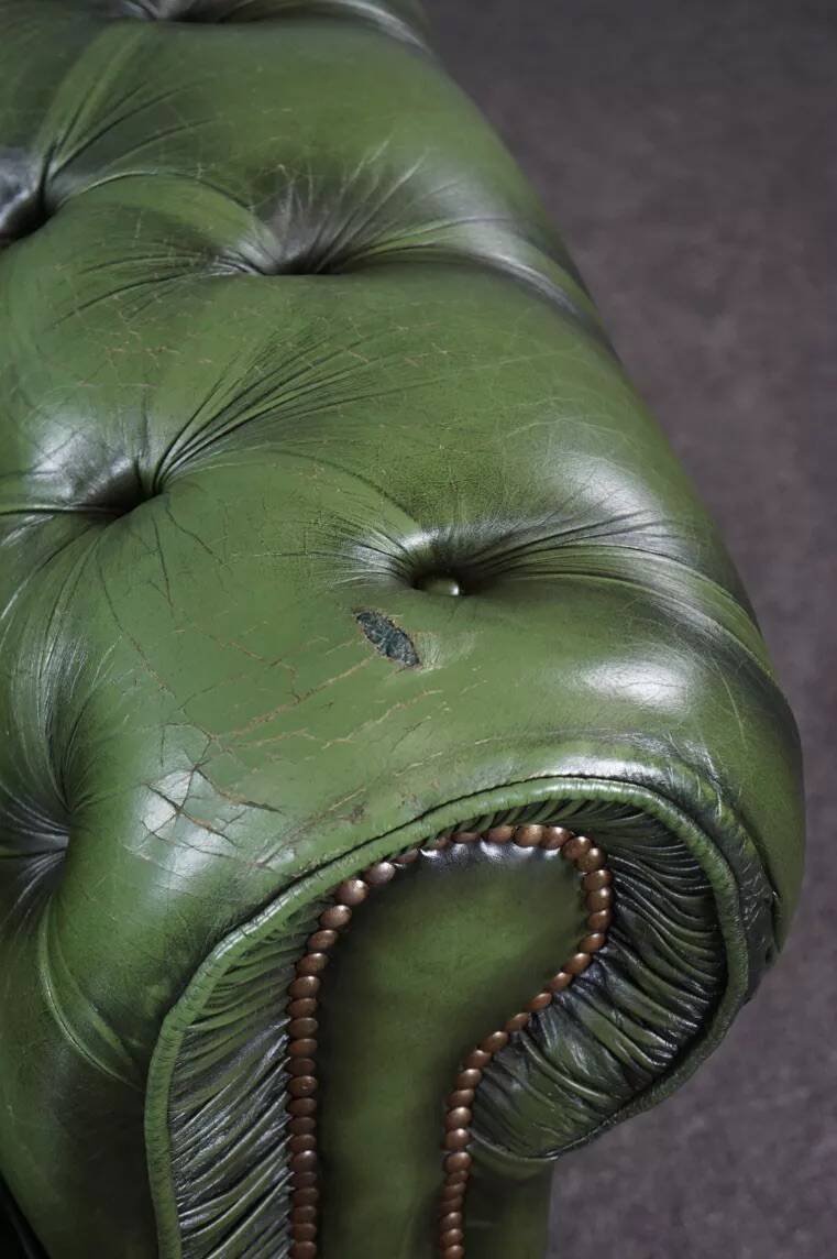 Spacious Chesterfield armchair in green patina
