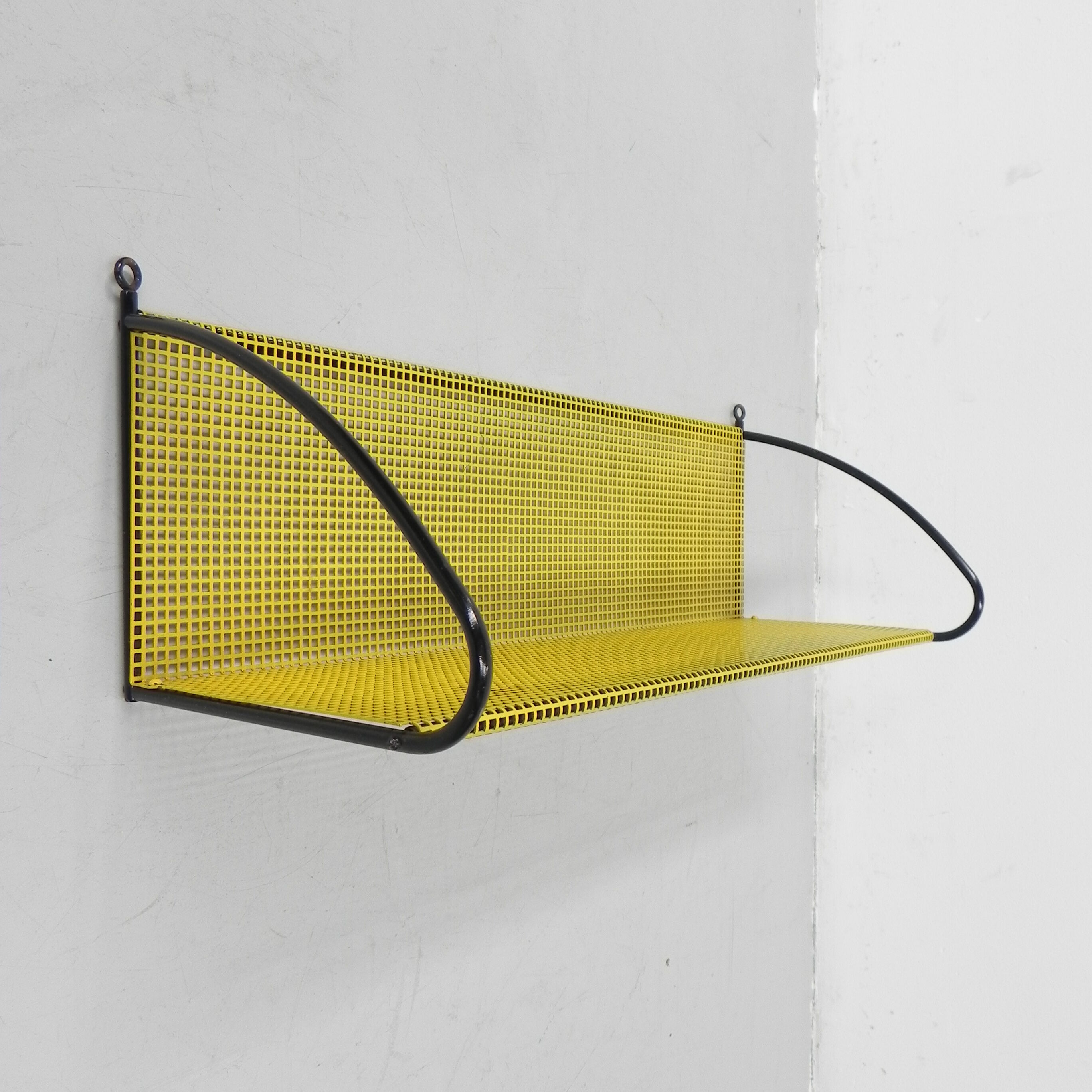Pilastro wall rack with perforated steel plate