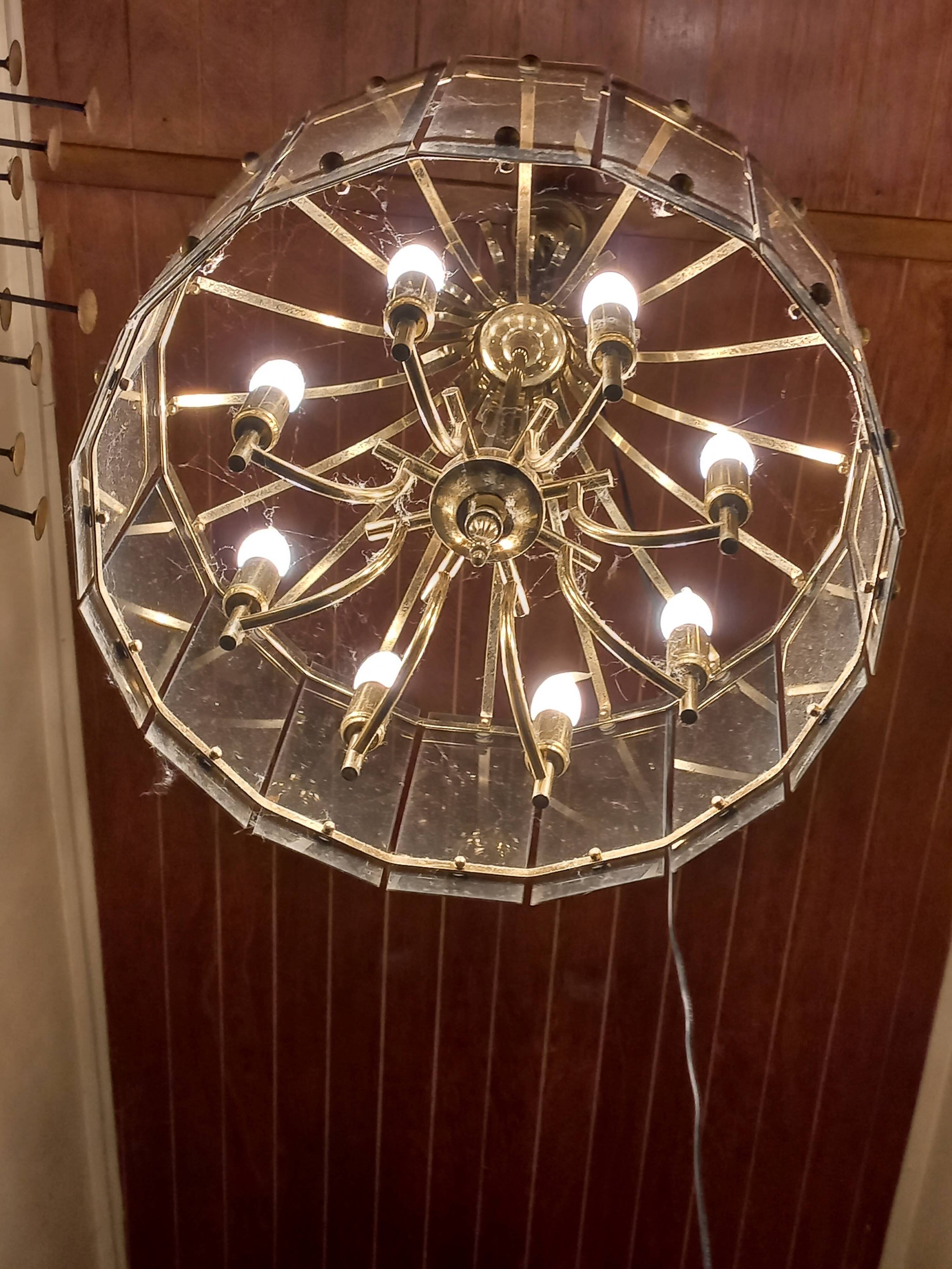 70s designer chandelier with smoked glass plates and gold metal frame