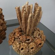 Trash in the form of the pineapple in natural fibers