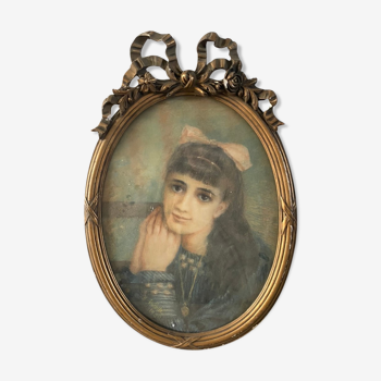 Portrait of a young girl in pastel and beautiful oval frame